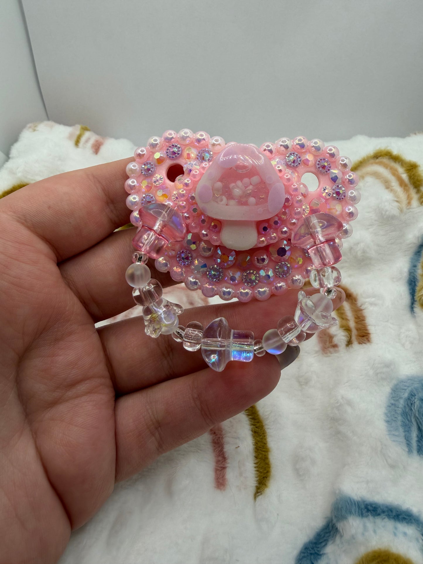 Pink Mushie Shaker Paci (Glass Bead Handle)