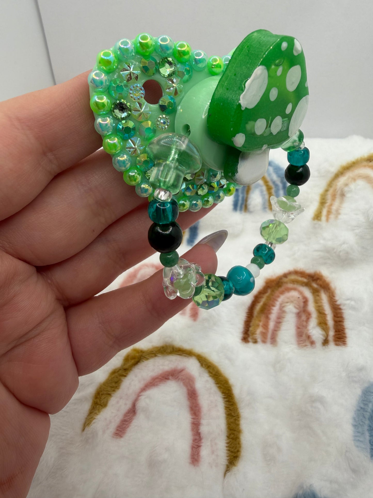 Green Mushie Shaker Paci (Glass Bead Handle)